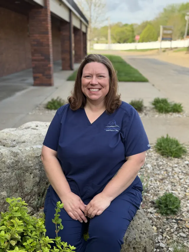 Misty, in navy Candlewood scrubs, outside the clinic